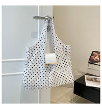 White polka dot bag